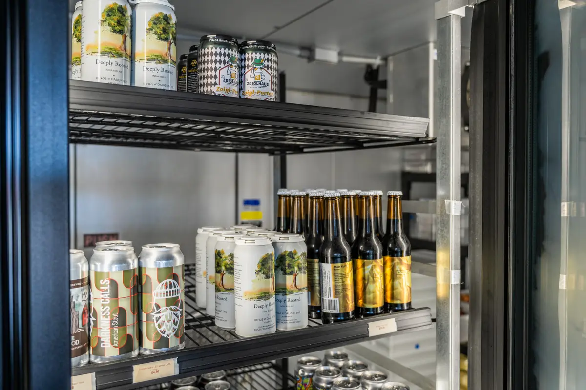 Craft beer cans and bottles in the fridge at Ballard Beer Box in Ballard, Seattle
