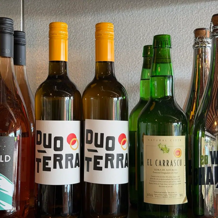 Natural wine and cider bottles on the shelf at Ballard Beer Box